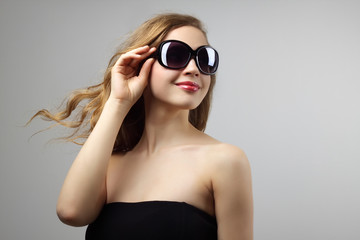 Fashionable lady wearing sunglasses