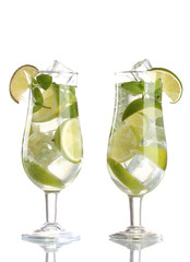 glasses of cocktail with lime and mint isolated on white