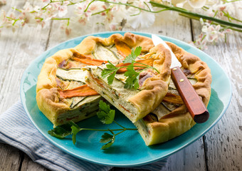 vegetables cake over dish on wood background