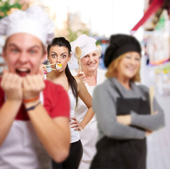 portrait of cook group doing gestures at street