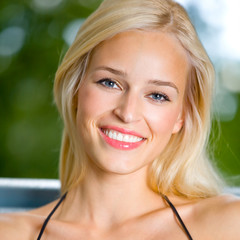 Smiling young beautiful woman, outdoors