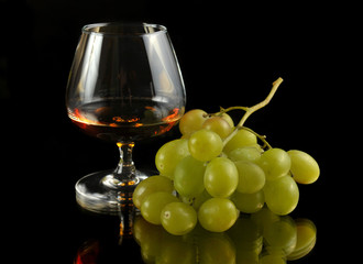 glass of brandy and grapes