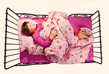 Girl sleeping in a bed