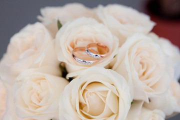 Gold ring on wedding bunch of flowers