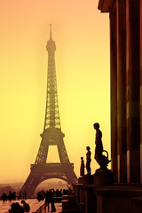 Eiffel Tower and silhouettes of sculptures