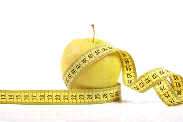 diet concept. apple with measuring tape