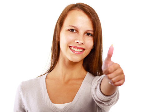 Close-up of pretty woman showing thumb up