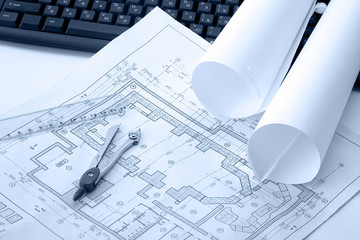 Architectural plans and blueprints in office