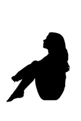 silhouette in shadow of a young woman sitting sad pensive