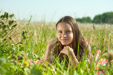 teenager girl lying in meadow