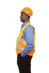 Young African constructor standing in profile isolated on white.
