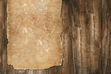 Grungy paper roll on a wooden background