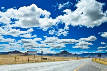 Fototapete Rund Road through a desolate landscape © pwollinga