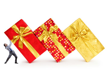 Businessman with gift boxes on white