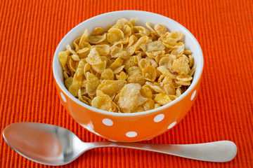 cornflakes in the bowl with spoon