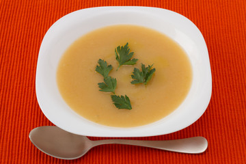 vegetable soup with parsley on the plate