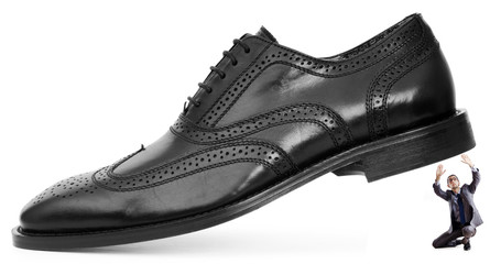 Woman domination concept with shoes and man