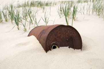 Rusty oil drum in the desert