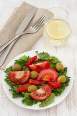 vegetable salad with olives on the plate