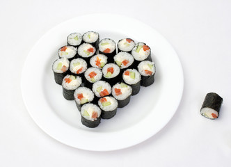 Sushi on plate in the shape of a heart