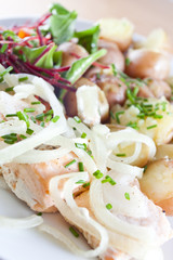 steamed salmon with fresh onion, herbs and baby potatoes