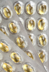three blisters of yellow pills, macro