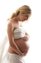 A young and happy blond pregnant Caucasian woman