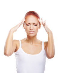 Fototapeta premium A young redhead Caucasian woman feeling a headache