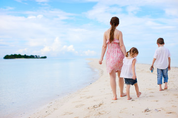 Mother and two kids on beach