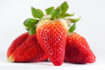Three strawberries isolated  on white