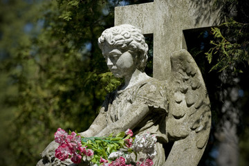 Old cemetery angel sculpture made of stone