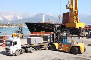 commercial harbor with truck forklift and ship