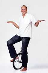 Man riding a unicycle © linkova