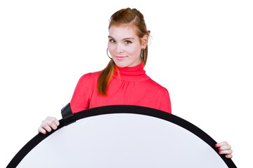 young model/photo assistent helping to set up the studio
