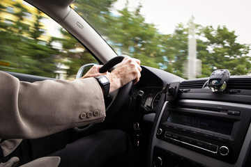 Driving a car (motion blur is used to convey movement)