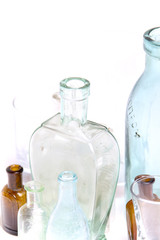 Vintage glass bottles on white