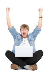 Man cheering with laptop computer