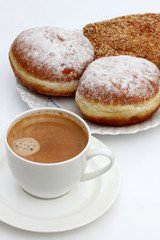 Coffee cup and pastry