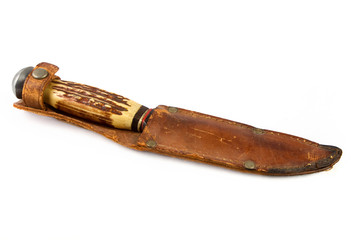 Old bone hunting knife in a leather sheath
