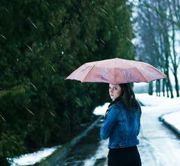 girl in a park in the rain