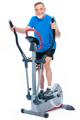 senior man exercising on stepper
