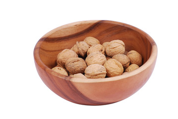 Wooden plate with walnuts