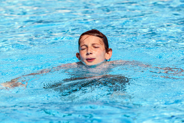 boy swimming in the pool