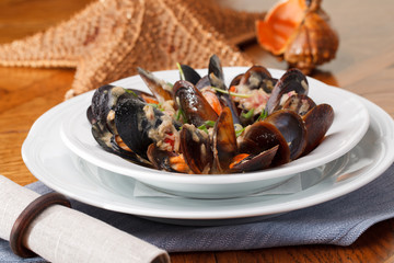 bowl with cooked mussels