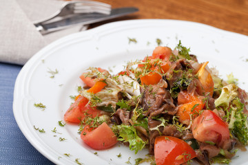 Tofu marinated in soy sauce with tomato and salad