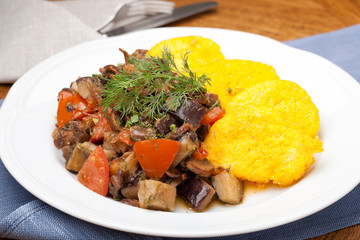 Polenta slices with vegetable stew
