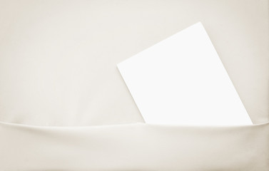 white paper in gray shelf.