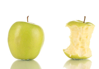 Green bitten apple and whole apple isolated on white