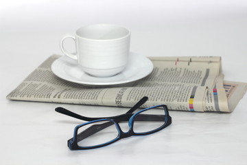 Glasses with the newspaper