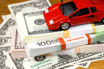 The money euro and dollars and small  automobile